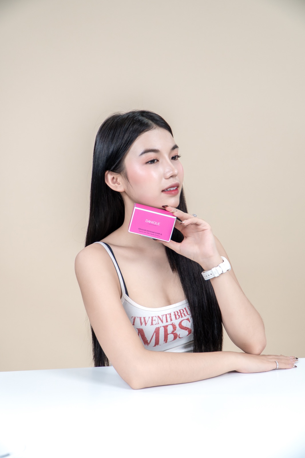 Model with DANIQUE Cellular Exosome Elixir box